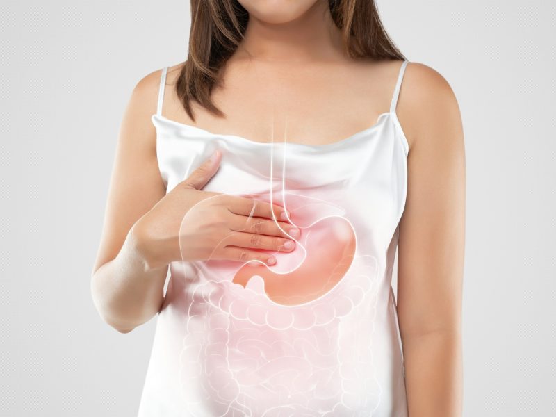 A woman suffering from gastroesophageal reflux disease